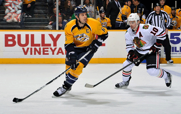 Shea Weber (left) attempting to break away from Patrick Sharp (right) in Nashville during the 2015 Playoffs. 